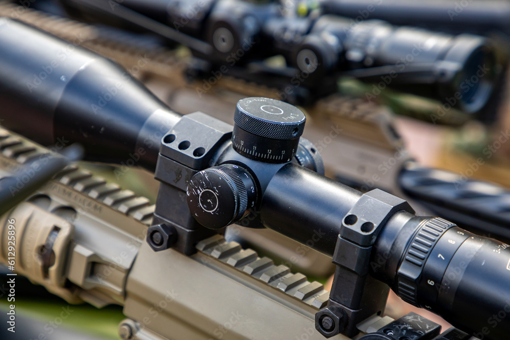 Wall mural Optical sight on a sniper gun. War in Ukraine.