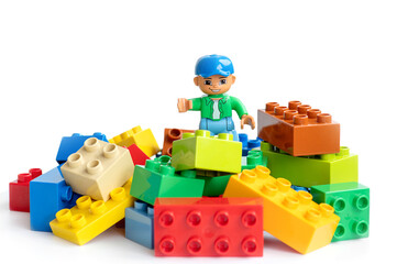 Naklejka premium Lego Duplo blocks and Lego man. Educational children's toys for the little ones.