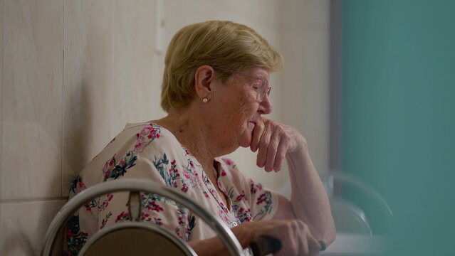 Contemplative senior woman at home, pensive elderly person in 80s with deep pensive expression