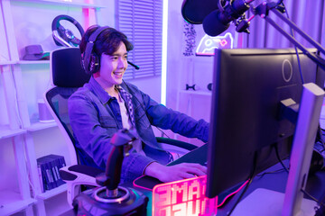 Male Gamer Playing PC Game with Mouse and Keyboard in Neon Game Room