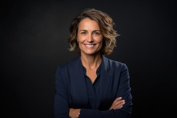 Smiling woman in blue suit looking at the camera Generative AI