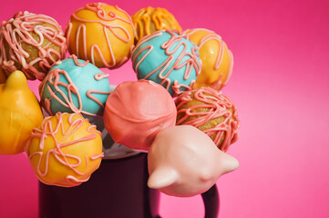 cake pops in chocolate glaze. sweet dessert, homemade cakes. background for the design.