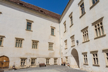 Walls in the courtyard of the  historical Fagaras Fortress on a sunny day. Transylvania. Romania