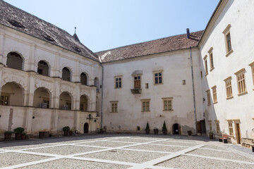 Fototapeta premium Walls in the courtyard of the historical Fagaras Fortress on a sunny day. Transylvania. Romania