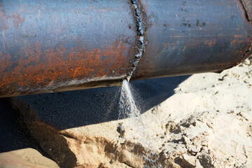 The water broke through an iron water pipe (busted water main). Lack of water saving, loss of...