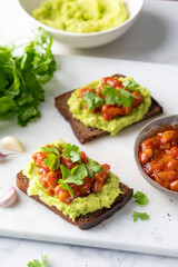 Avocado toast with mashed avocado and baked beans topping, healthy vegan protein and healthy fats packed snack or lunch