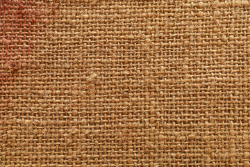 Rough textured surface of burlap or canvas close-up. Background or backdrop. Design blank