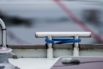 Shiny metal bollard on a sailboat.