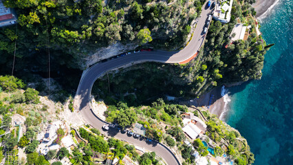 Winding road aerial drone view in Amalfi Coast Positano Italy