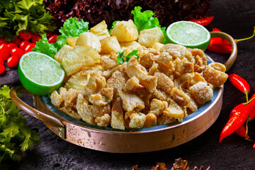 Brazilian cassava food, crackling pork