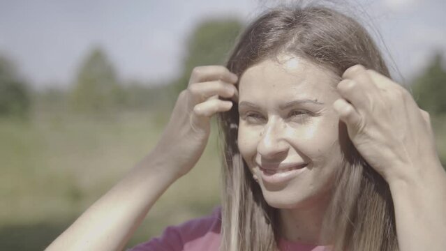 girl squinting at the sun