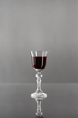 cherry liqueur in a glass on the table. Made from fresh and juicy berries.