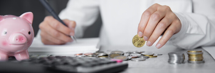 man hand  coins and calculator