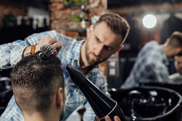 Work in the barber shop. Man hairstylist