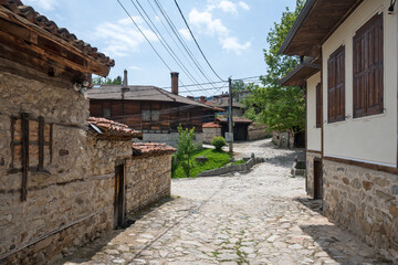Fototapeta na wymiar Street and old houses in Koprivshtitsa, Bulgaria