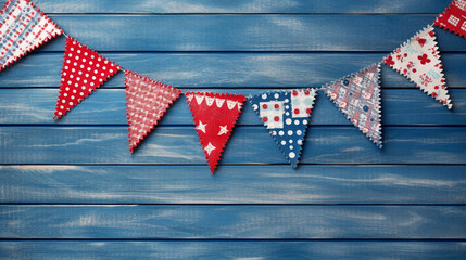 Obraz premium Patriotic American Themed Fourth of July Bunting Decoration Flat Lay - on Aged Blue Wood Backdrop with Copy Space - 4th of July Crafts - Cloth in USA Red, White, and Blue Flag Colors - Generative AI