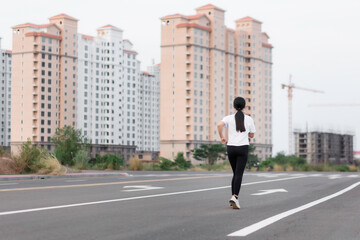 Asian young women running outdoors, healthy lifestyle, and sports concepts