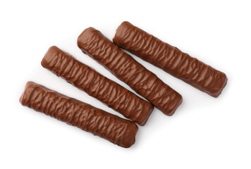 Sweet tasty chocolate bars on white background, top view