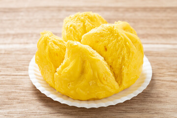 angle view Chinese style yellow color steamed bun