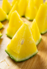 angle view small slices yellow color fresh watermelon at vertical composition
