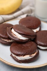 Tasty sweet choco pies on table, closeup