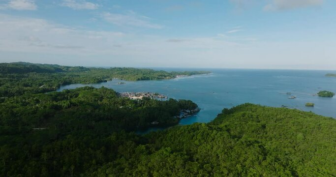 Aerial view of small village in coastal of Tropical Island. Seascape. Mindanao, Philippines.