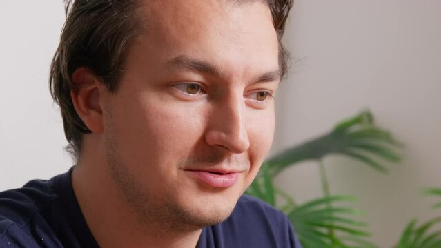 Handsome self-confident sugary man smirks, looks with languid look, smiles on date. Gigolo meets, charms, flirts. Pickup courses. Conversation of homosexuals, gays. Romantic facial expressions 