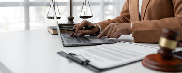Businesswoman, lawyer or legal consultant using laptop to check details and search Look at the information before signing the financial contract terms and conditions. business concept justice