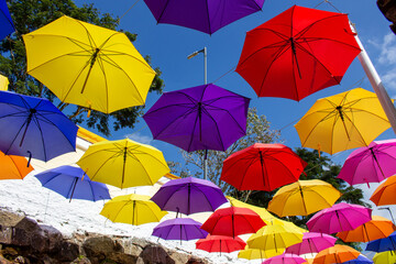 Fototapeta na wymiar Street covered with umbrellas. Street decoration