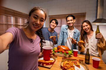 Group of Asian friend having dinner, enjoy evening party together at home. - obrazy, fototapety, plakaty