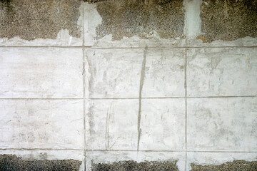 Old cement wall that has been used in the past Causing