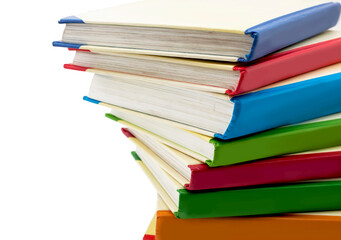 Multicolored books. The school. Stack of bright children's books on white background