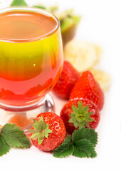 strawberry jelly in glasses with fresh berries and fruits on a white background