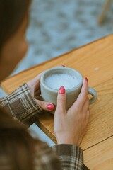Holding a cup of taro 