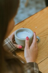 Holding a cup of taro 