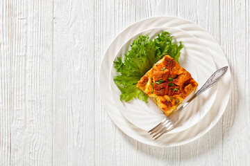Scalloped Chicken Casserole topped with croutons