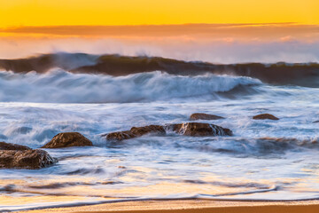 Sunrise and Waves - Surf's up at the seaside