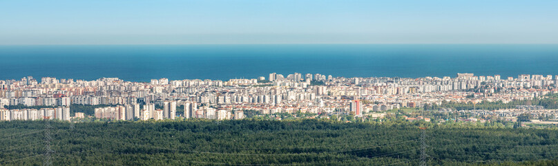 Fototapeta na wymiar Panoramic cityscape view of Antalya resort town and mediterranean sea in the background