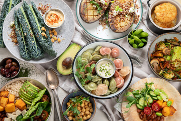 Vegetarian and various vegan dishes on light table. Healthy food concept with vitamins, fiber and antioxidants.