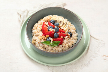 Healthy homemade oatmeal with berries for breakfast.