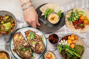 Vegetarian and various vegan dishes on light table. Healthy food concept with vitamins, fiber and antioxidants.