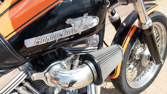 harley davidson brand logo tank fuel with text sign on orange black american motorcycle us custom motorbike