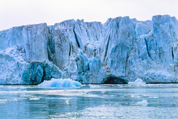 Glacier with big seracs by the sea in arctic