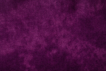 紫色のムラ染めの布地の背景テクスチャー