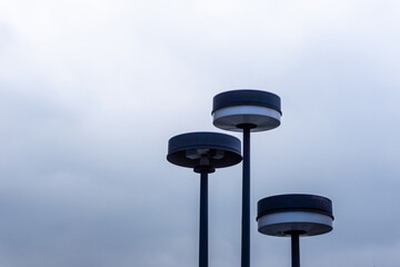 Street lamps and cloudy sky