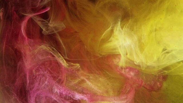 Color smoke. Ink water splash. Acrylic paint mix. Bright yellow pink vapor cloud wave motion abstract art background for transition.