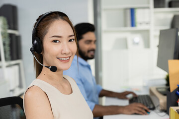 Close up female smiling wear headset operator worker call center hotline. woman working customer support service operator. communication in corporate, Business advisor concept.