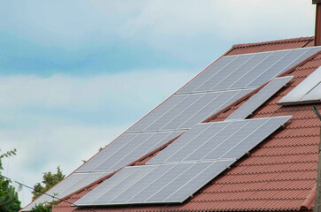Installing a Solar Cell on a Roof.