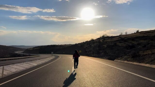 crazy man running on asphalt road