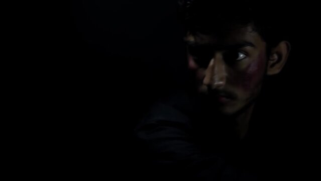 Intense Shot of the victim punching the gangster on the face in a mysterious room with dark lights HD footage in 24FPS.